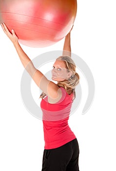 Woman exercising with a pilates ball