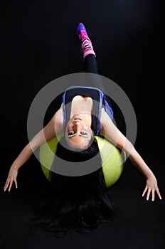 Woman Exercising on Pilates Ball
