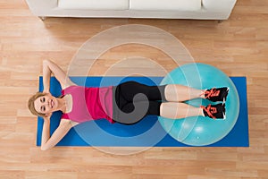 Woman Exercising With Pilates Ball