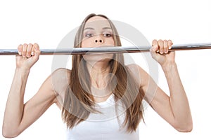 Woman exercising on pull-up bar