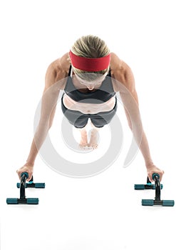 Woman exercising push up fitness bar