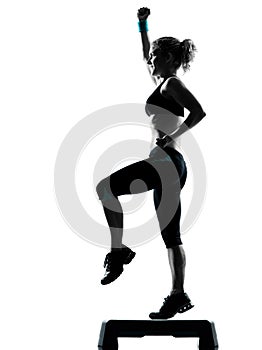 Woman exercising step aerobics