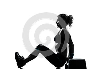 Woman exercising step aerobics