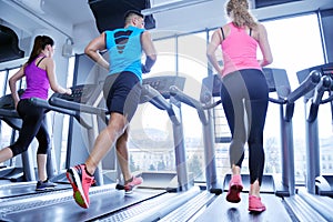 Woman exercising on treadmill in gym