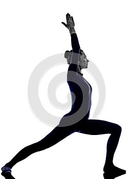 Woman exercising Virbhadrasana I warrior pose yoga silhouette