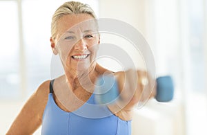 Woman Exercising With Weights At Home