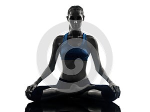 Woman exercising yoga meditating silhouette