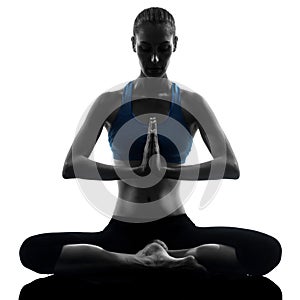 Woman exercising yoga meditating sitting hands joined