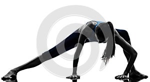 Woman exercising yoga stretching legs warm up silhouette