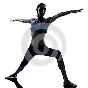 Woman exercising yoga warrior position 2