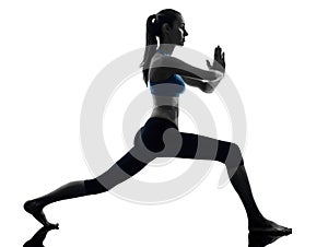 Woman exercising yoga warrior position