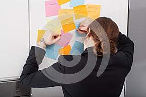 Woman is exhausted of too much daily tasks