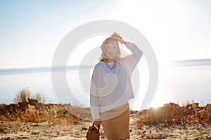 Woman expecting a baby feeling happy during a walk