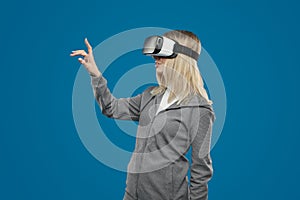 Woman experiencing virtual reality in VR goggles