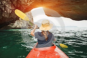 Woman explore Ha Long Bay on kayak