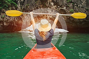 Woman explore Ha Long Bay on kayak