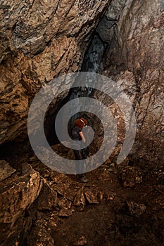 Woman explorer in a cave