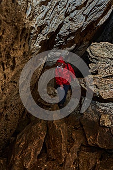 Woman explorer in a cave