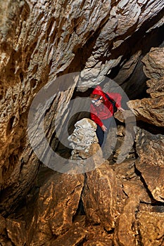 Woman explorer in a cave