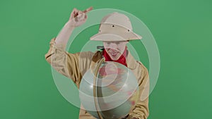 Woman explorer walking his fingers on the globe