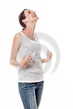 Woman expressing delight and pleasure looking up for satisfaction