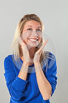 Woman expressing herself with hands and toothy smile