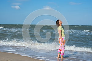 Woman with expressive face on beach