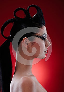 Woman with extravagant makeup and hairstyle