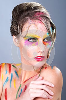 Woman With Extreme Makeup Design With Colorful Powder