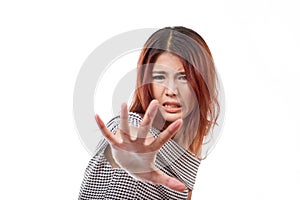 Woman with extremely fearful mood showing stop, reject, refuse