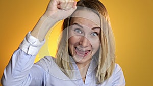 Woman exults for victory or something extreme positive: happiness, exultation