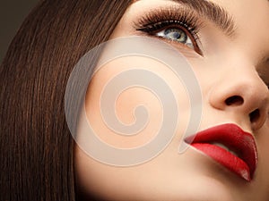 Woman Eye With Beautiful Makeup and Long Eyelashes. Red Lips. Hi