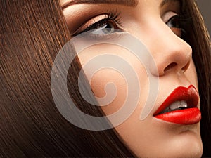 Woman Eye with Beautiful Makeup. Red Lips. High quality image.