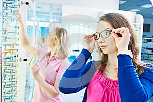 Woman at eye glasses shop