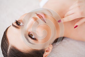 Woman Eye with Long Eyelashes. Beautiful Young Woman During Eyelash Extension