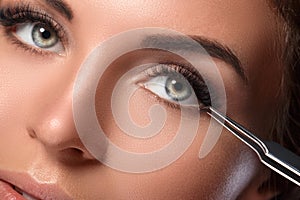 Woman with eyelash extension for maximum volume