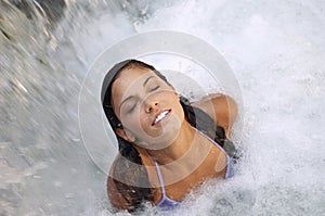 Woman With Eyes Closed Enjoying Waterfall