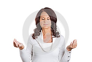 Woman with eyes closed hands raised in air meditating