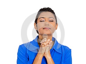 Woman eyes closed praying hoping for the best