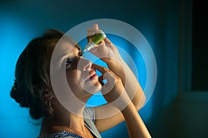 Woman With Eyes Tired Applying Collyrium Eye Drops