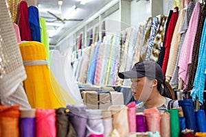 Woman in fabric shop