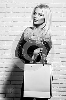 Woman face beauty. pretty girl with shopping bag