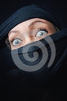 Woman face close up with only eyes visible