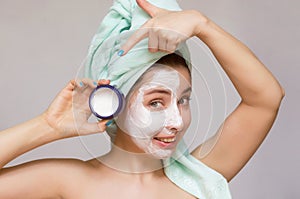 Woman with a face cream mask. Face skin care. Skin treatment.