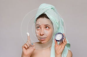 Woman with a face cream mask. Face skin care. Skin treatment.