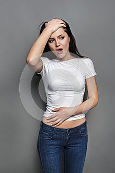 Woman face expressing shock or ache, surprise