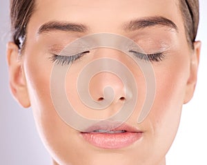 Woman, face and eyes closed for makeup, cosmetics and laser transformation on studio background. Closeup female model