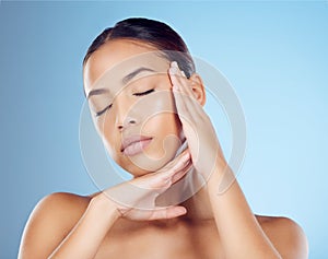 Woman, face and eyes closed in studio for beauty, wellness spa and skincare glow of makeup salon. Calm model, facial and