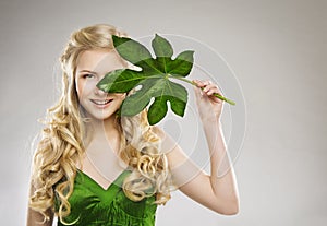 Woman Face and Green Leaf, Hair Organic Treatment and Skin Care