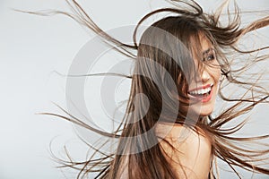 Woman face with hair motion on white background isolated